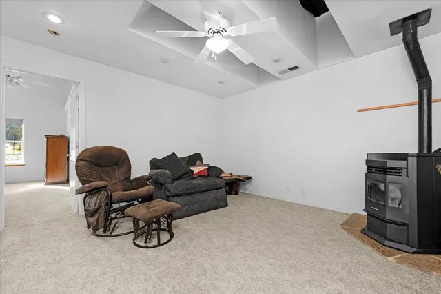 a view of a swimming pool with a lawn chairs under an umbrella
