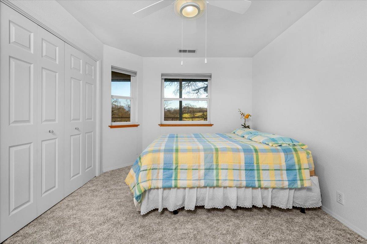 10925 Rusty Spur Lane Clovis, CA 93619 - Photo 31 of 94 a bedroom with a bed and a window