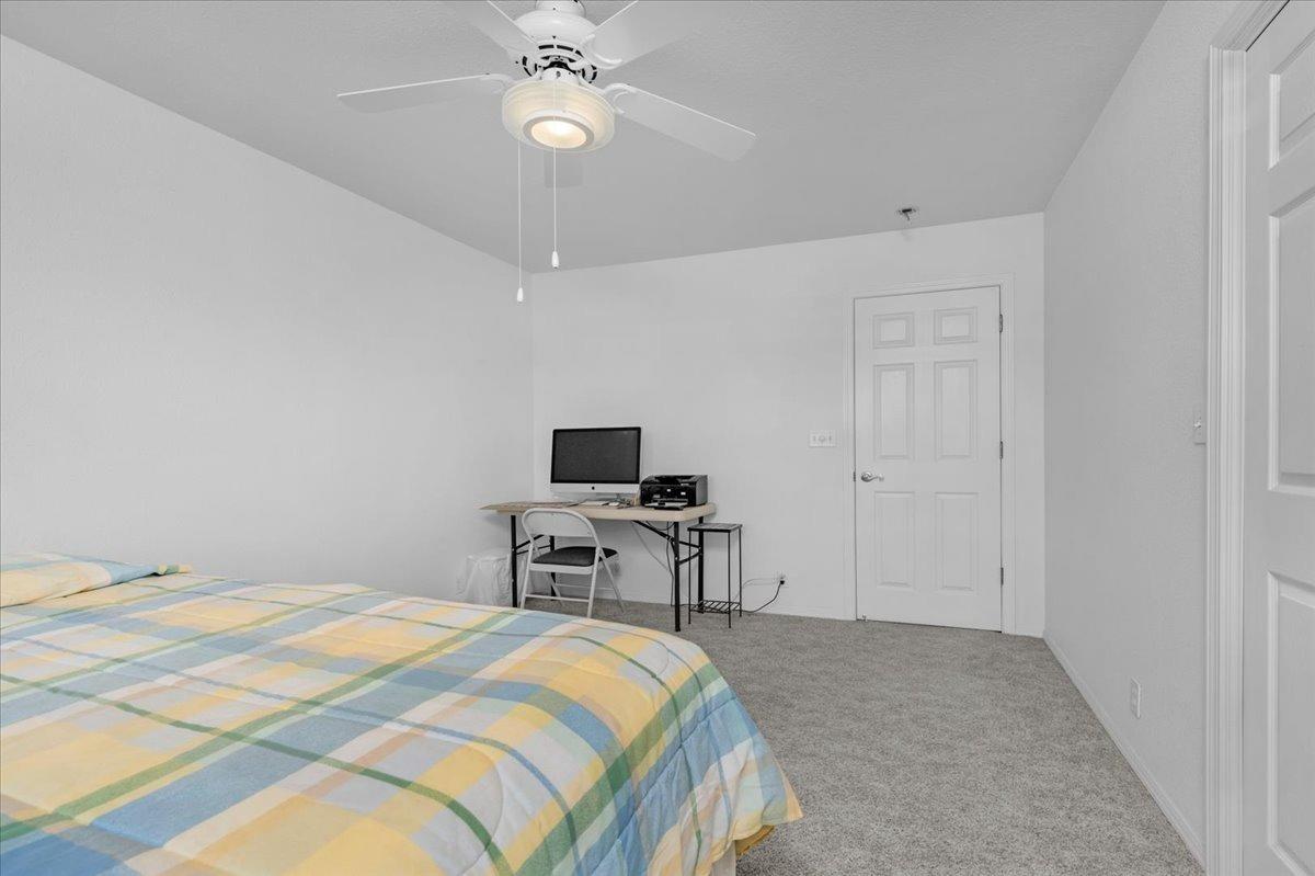 10925 Rusty Spur Lane Clovis, CA 93619 - Photo 32 of 94 a bedroom with a bed and a tv