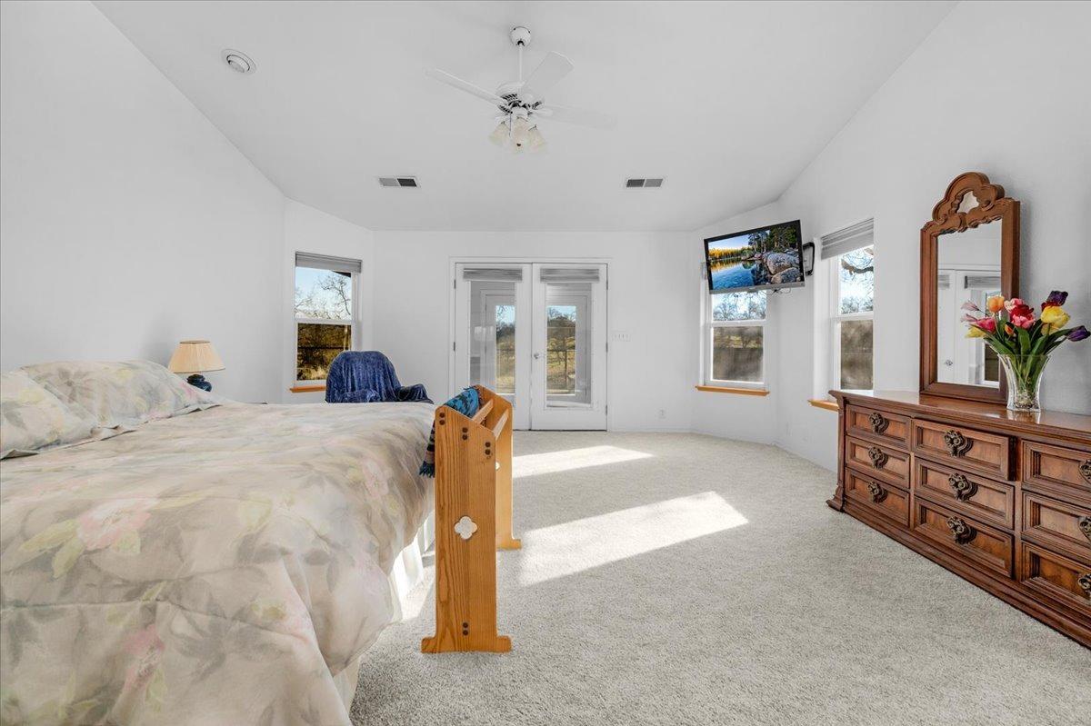 10925 Rusty Spur Lane Clovis, CA 93619 - Photo 35 of 94 a bed room with a bed and a dresser