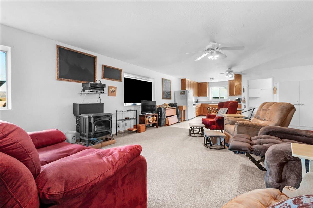 10925 Rusty Spur Lane Clovis, CA 93619 - Photo 50 of 94 a living room with furniture and a flat screen tv