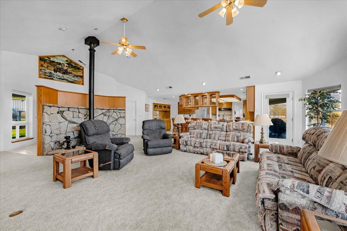 10925 Rusty Spur Lane Clovis, CA 93619 - Photo 7 of 94 a living room with furniture and a chandelier