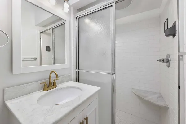 a bathroom with a sink and mirror