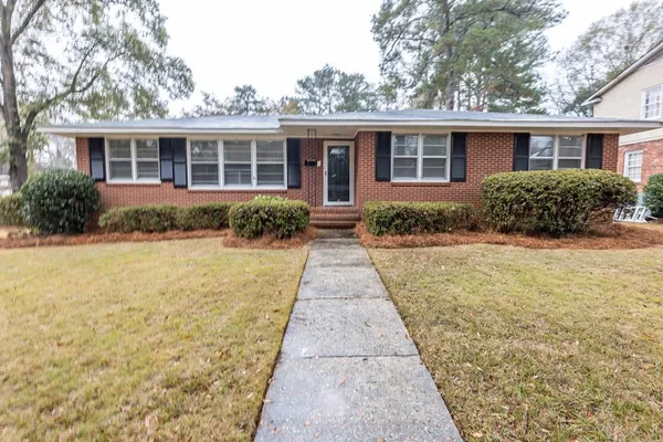 front view of a house with a yard