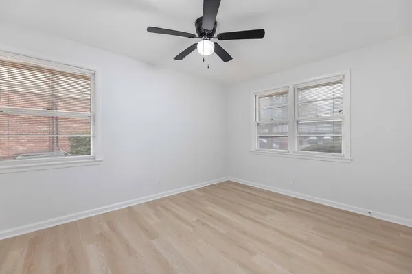 a view of room with window and ceiling fan