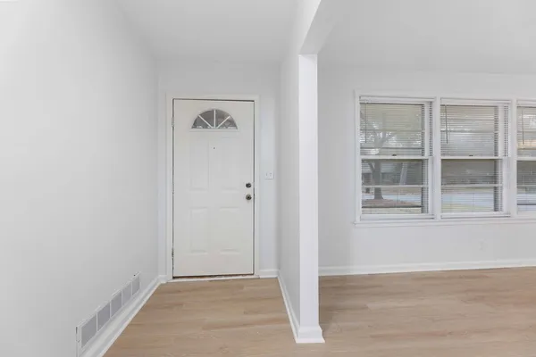 a view of an empty room with a window