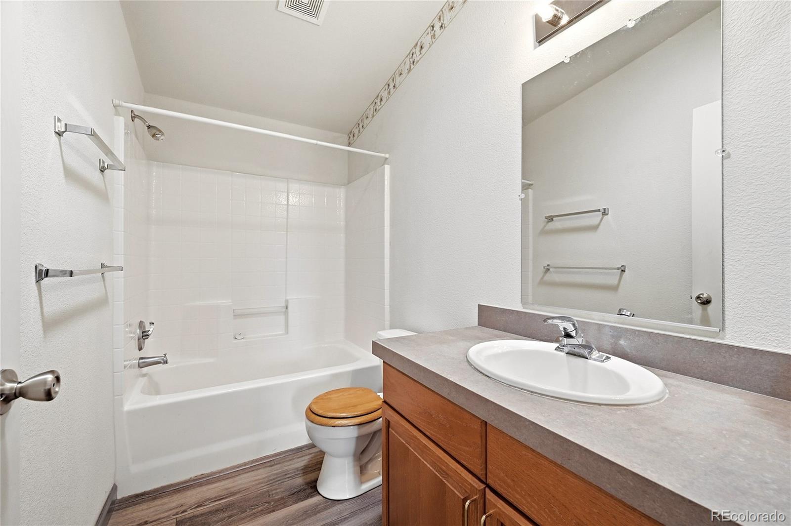 20300 Old Ranch Loop Nathrop, CO 81236 - Photo 20 of 35 a bathroom with a granite countertop sink toilet and shower