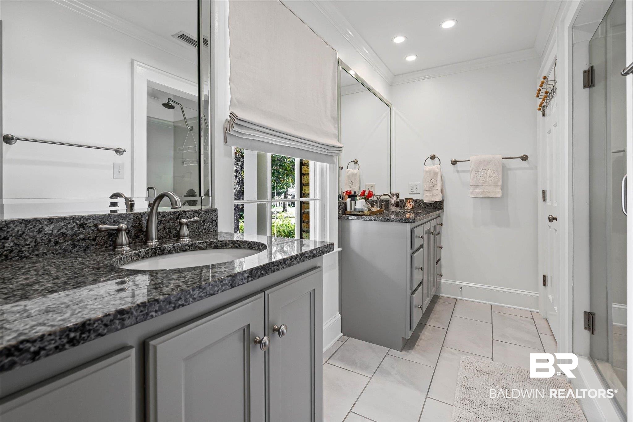 513 Spring Park Drive East Mobile, AL 36608 - Photo 23 of 44 Bathroom with ornamental molding, two vanities, light tile patterned flooring, a stall shower, and recessed lighting
