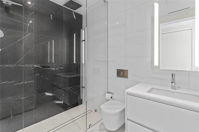 a bathroom with a bathtub and shower