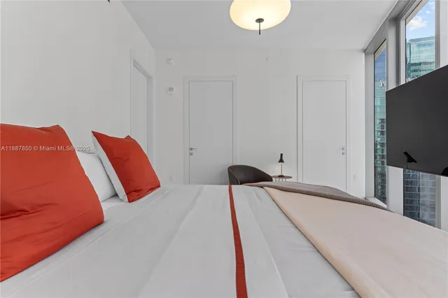 a bathroom with a shower a toilet and a sink