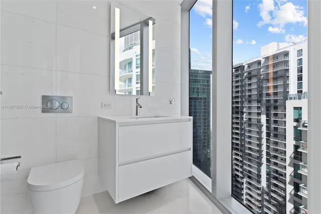 a close view of a utility room with dryer and washer