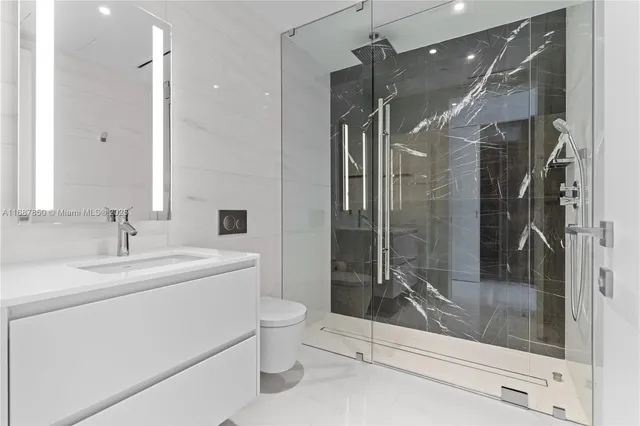 a living room with furniture and large windows