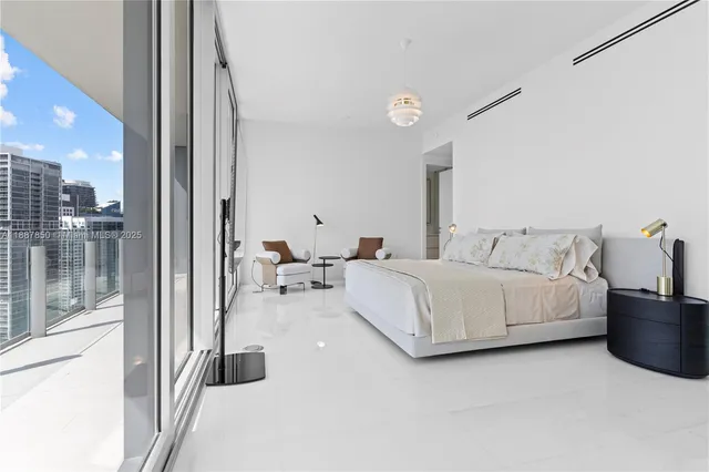 a spacious bathroom with a double vanity sink a mirror and a shower