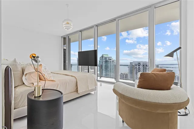a bathroom with a shower and a glass door