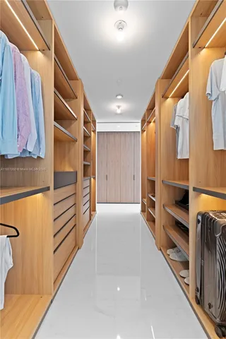 a bedroom with a bed and a mirror