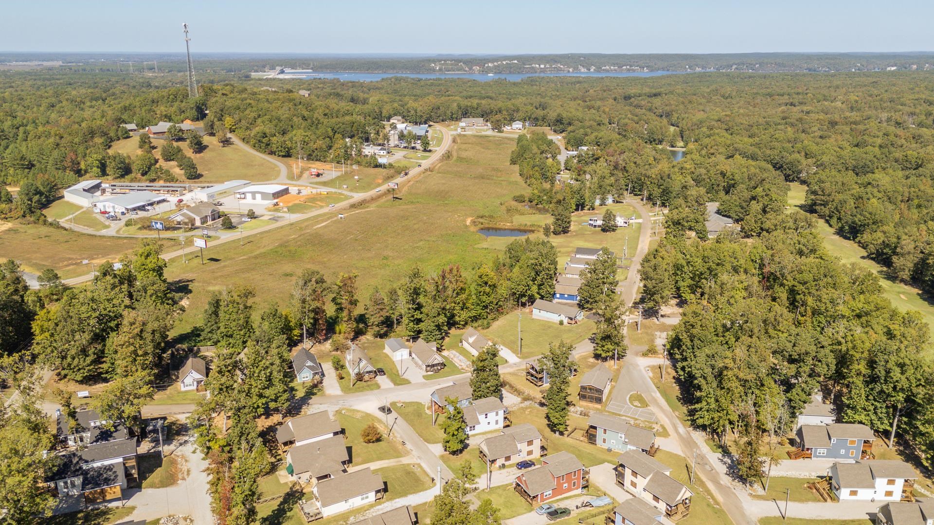 25 Bogey Loop Counce, TN 38326 - Photo 33 of 37 Aerial overview of property's location with nearby suburban area and a large body of water