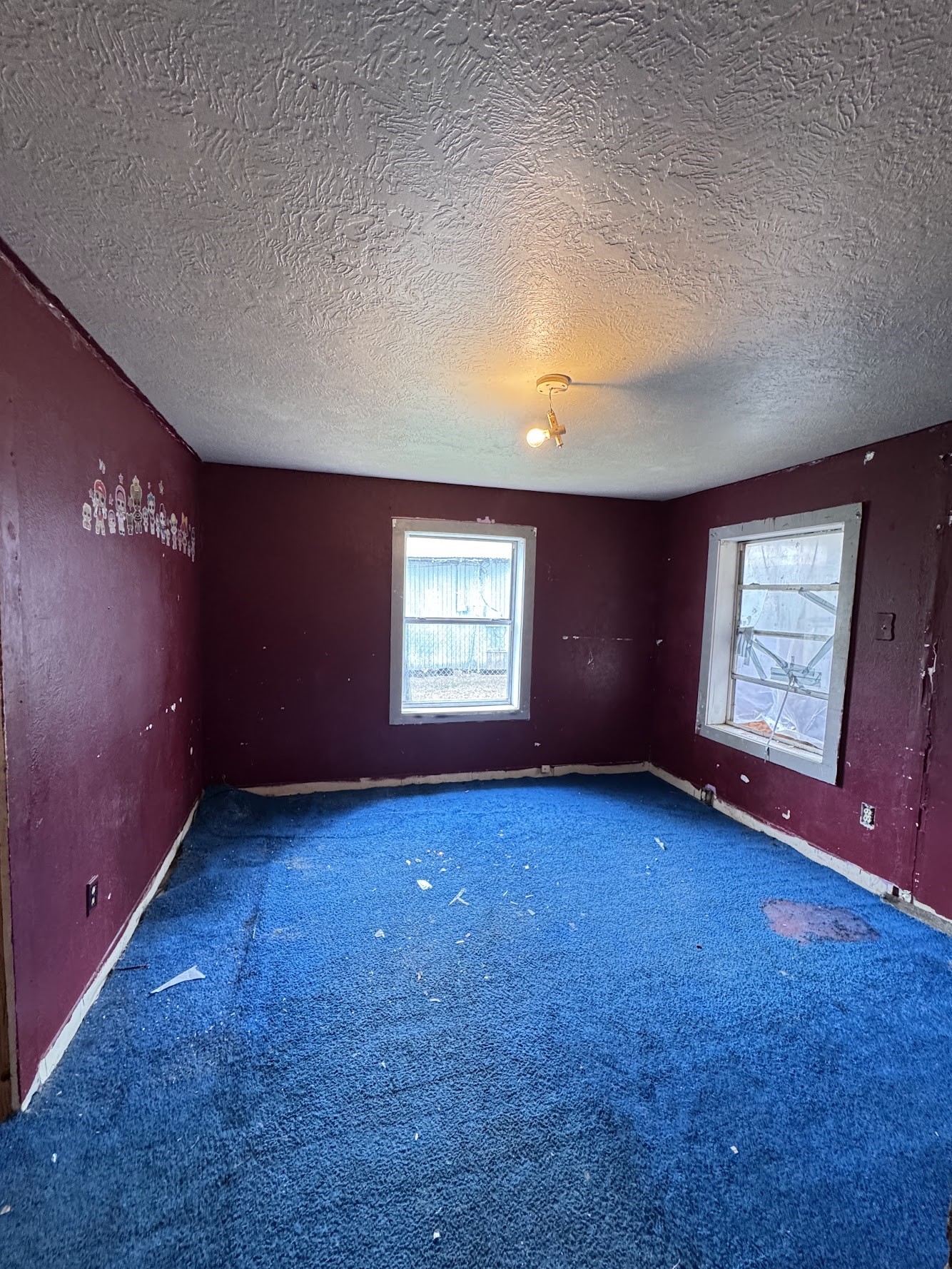 916 Lamar Street Cleveland, TX 77327 - Photo 14 of 18 an empty room with windows