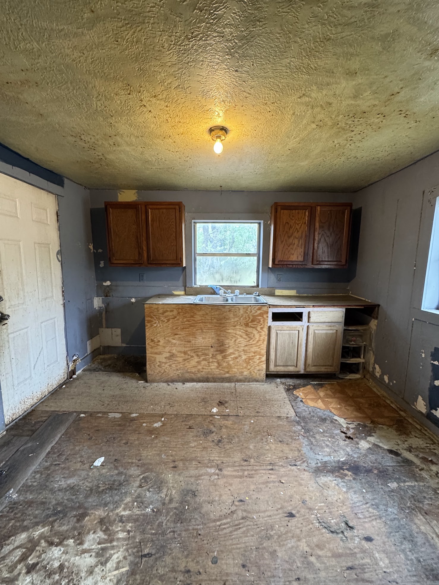 916 Lamar Street Cleveland, TX 77327 - Photo 18 of 18 a view of a kitchen with a sink cabinets and a refrigerator