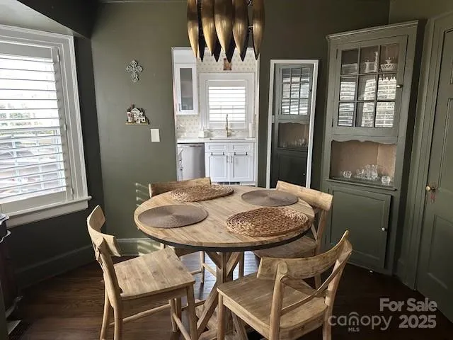 a view of a dining room with furniture and window