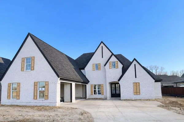 a front view of a house with a garage