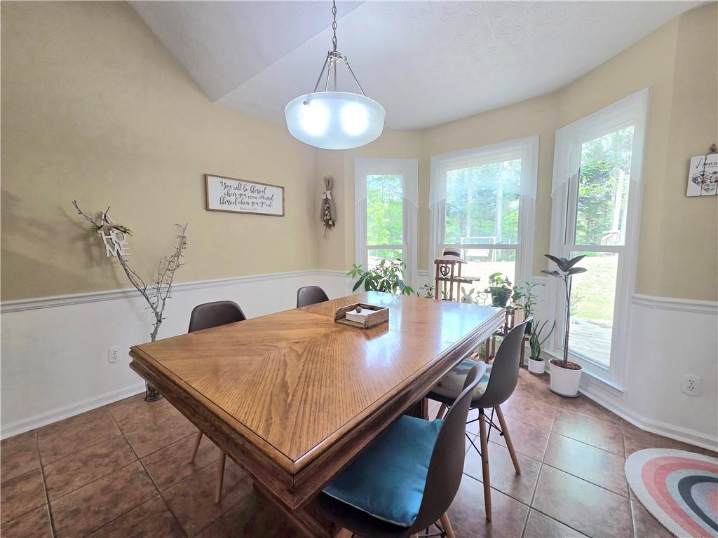 2395 Ashton Ridge Drive Dacula, GA 30019 - Photo 12 of 38 a view of a dining room with furniture and wooden floor