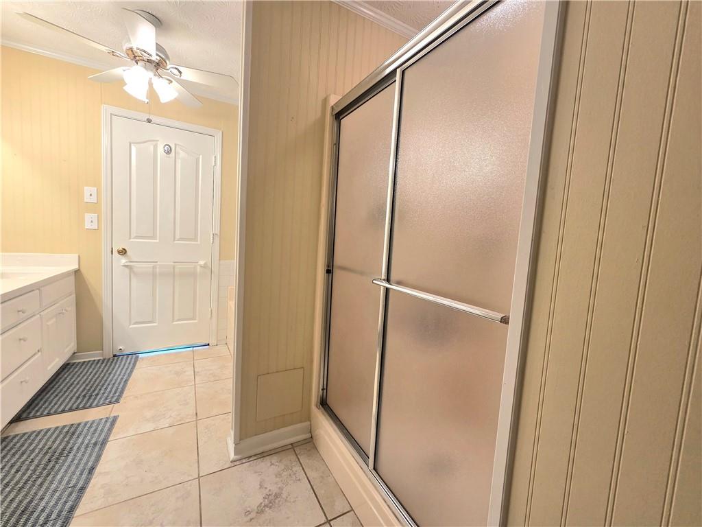 2395 Ashton Ridge Drive Dacula, GA 30019 - Photo 19 of 38 a bathroom with a shower and a mirror