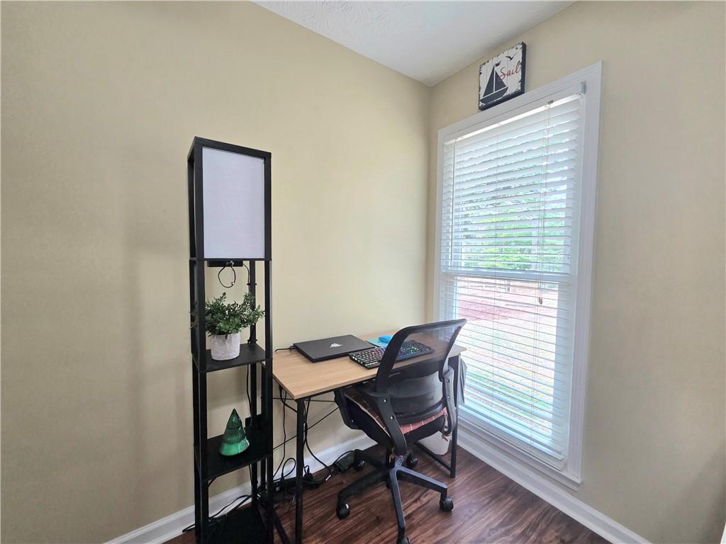 2395 Ashton Ridge Drive Dacula, GA 30019 - Photo 24 of 38 a view of a workspace with furniture and a window