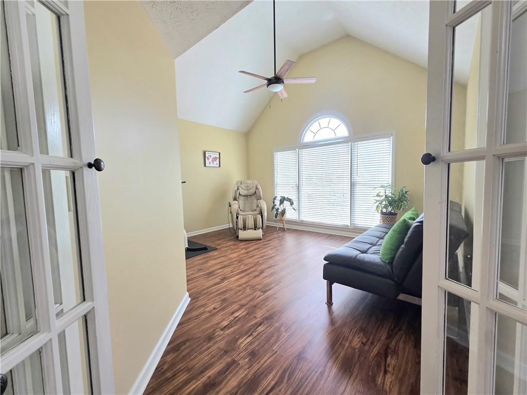 2395 Ashton Ridge Drive Dacula, GA 30019 - Photo 28 of 38 a living room with furniture and a chandelier