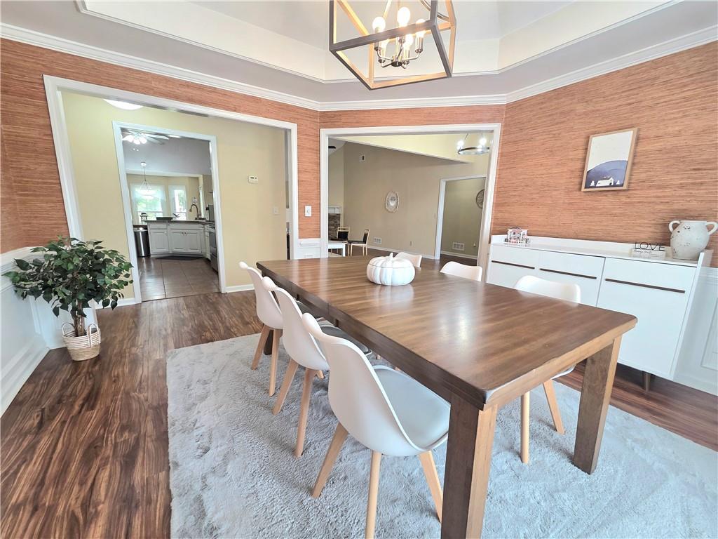 2395 Ashton Ridge Drive Dacula, GA 30019 - Photo 6 of 38 a view of a dining room with furniture and wooden floor