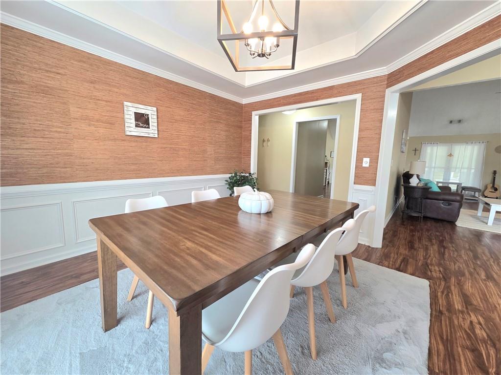 2395 Ashton Ridge Drive Dacula, GA 30019 - Photo 7 of 38 a view of a dining room with furniture and wooden floor