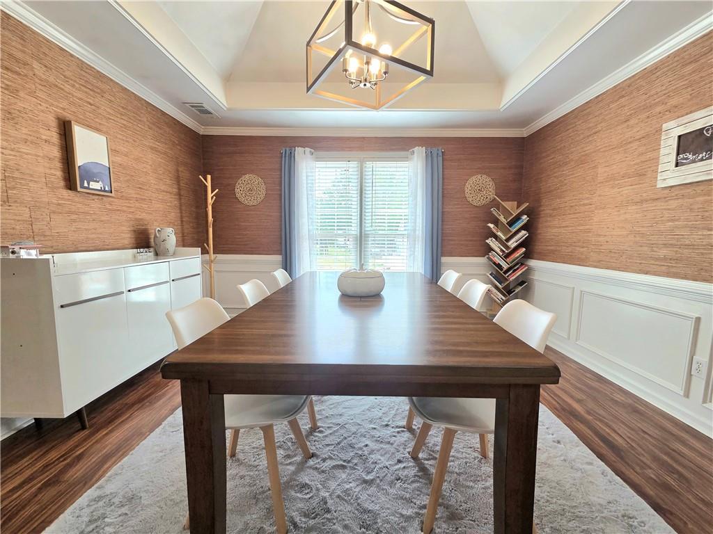 2395 Ashton Ridge Drive Dacula, GA 30019 - Photo 8 of 38 a view of a dining room with furniture window and wooden floor