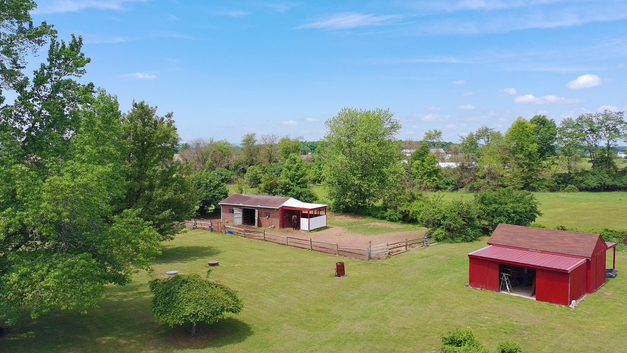 2226 Harney Road Littlestown, PA 17340 - Photo 32 of 40 a backyard of a house with table and chairs