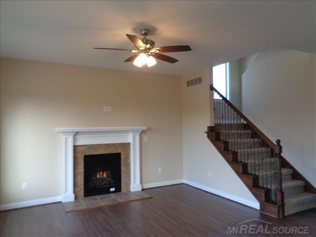 28510 Cotton Road New Baltimore, MI 48047 - Photo 3 of 25 Gas fireplace with surround, open to kitchen and nook