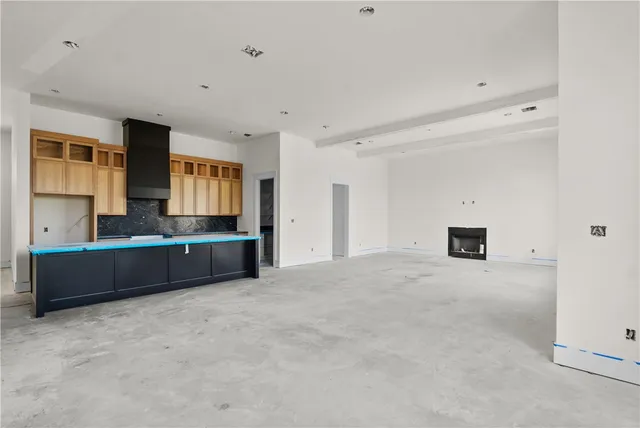 a large room with a couch and a view of living room