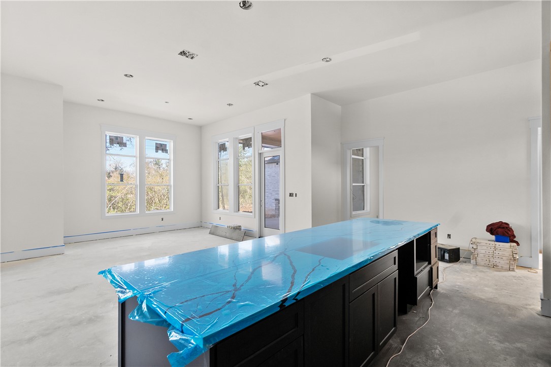 3022 Silverbell Court Bryan, TX 77807 - Photo 14 of 28 a kitchen with stainless steel appliances granite countertop a sink stove and refrigerator