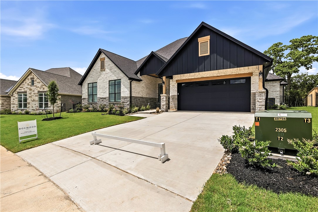 3022 Silverbell Court Bryan, TX 77807 - Photo 2 of 39 a front view of a house with garden