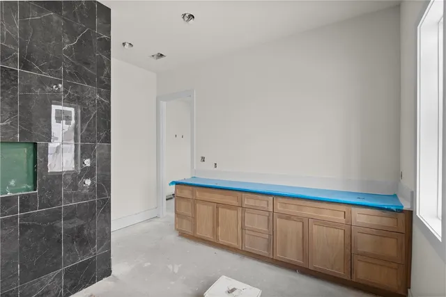 a brick building with bench in front of it