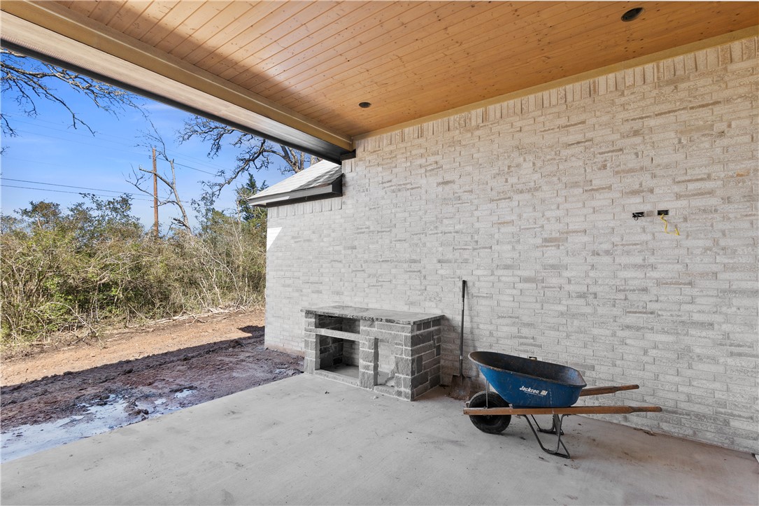 3022 Silverbell Court Bryan, TX 77807 - Photo 27 of 28 a brick building with bench in front of it
