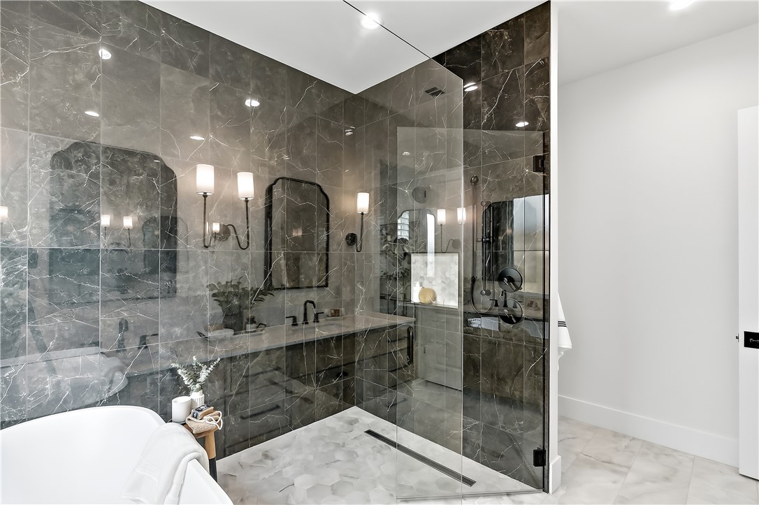 3022 Silverbell Court Bryan, TX 77807 - Photo 28 of 39 a bathroom with a sink mirror and shower