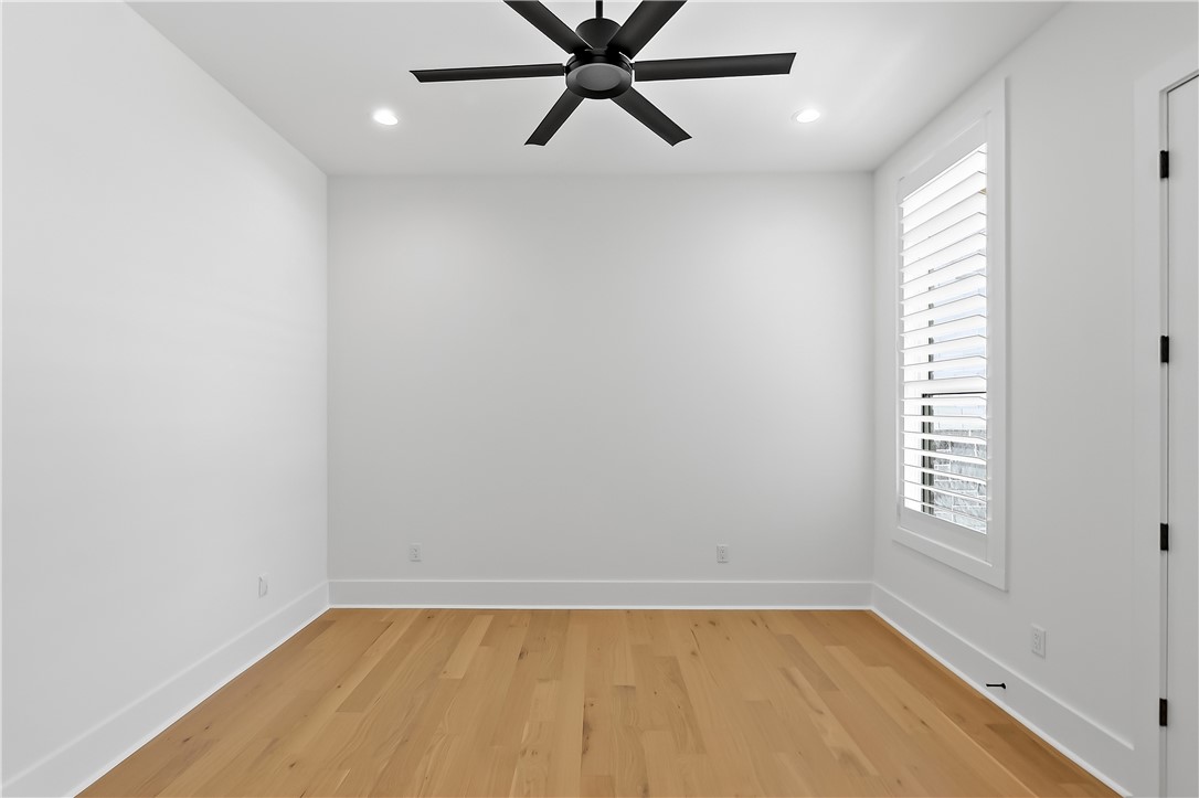 3022 Silverbell Court Bryan, TX 77807 - Photo 33 of 39 a view of an empty room with a window and a ceiling fan