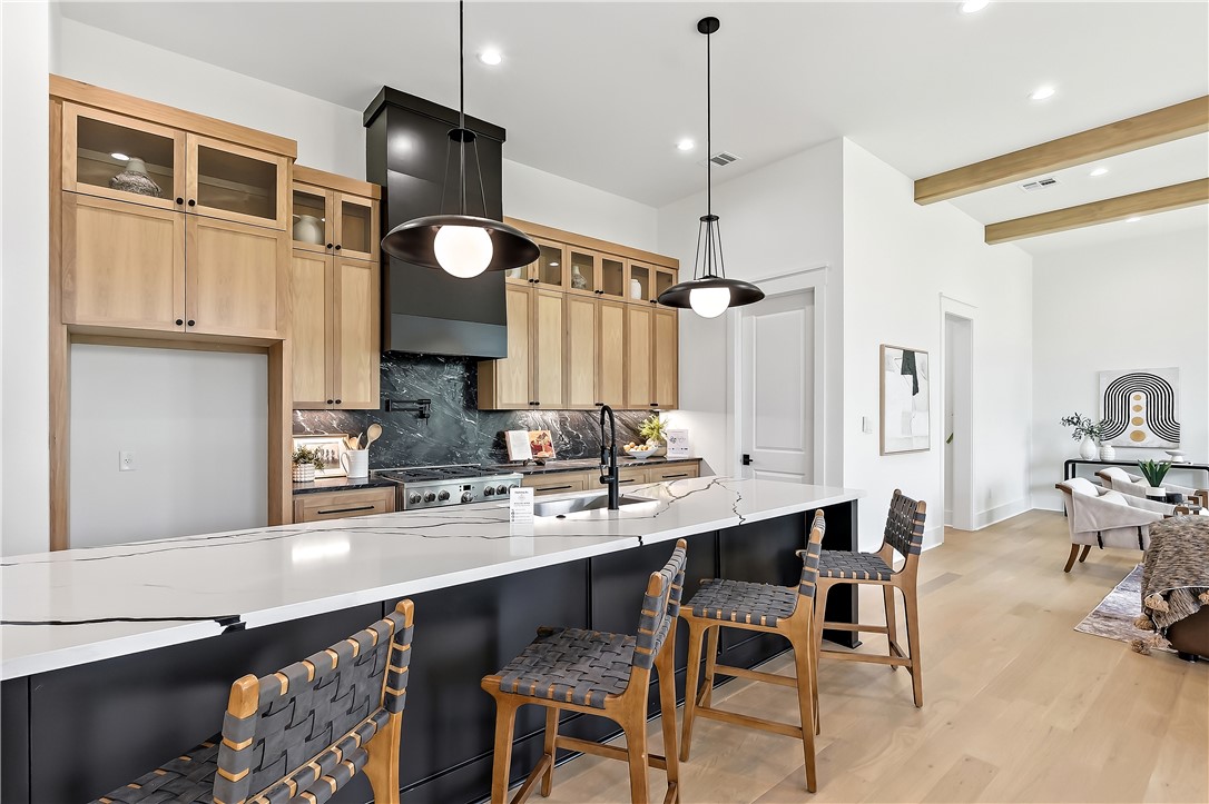 3022 Silverbell Court Bryan, TX 77807 - Photo 6 of 39 a kitchen with cabinets and chairs
