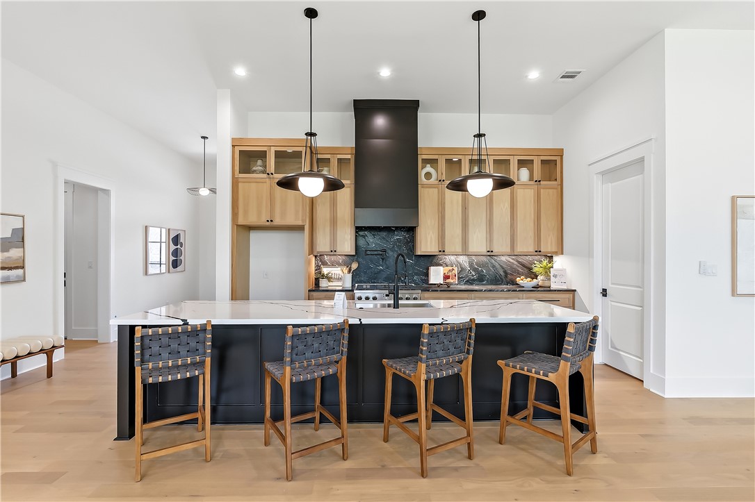3022 Silverbell Court Bryan, TX 77807 - Photo 7 of 39 a large kitchen with a table and chairs