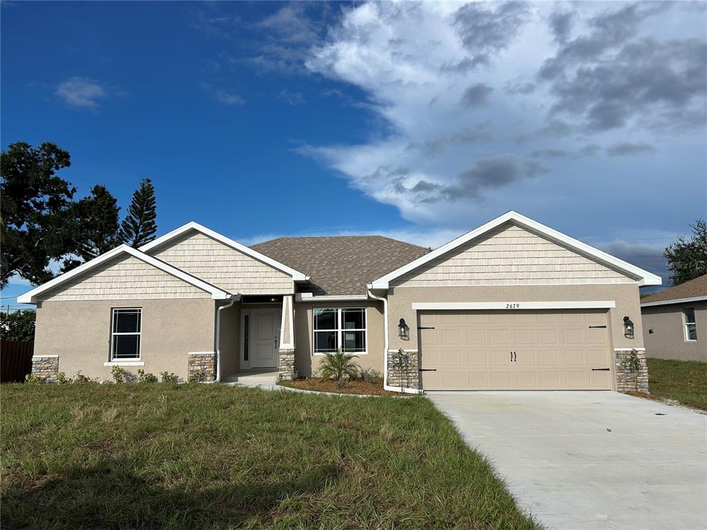 2679 Englewood Road Venice, FL 34293 - Photo 1 of 1 front view of a house with a yard