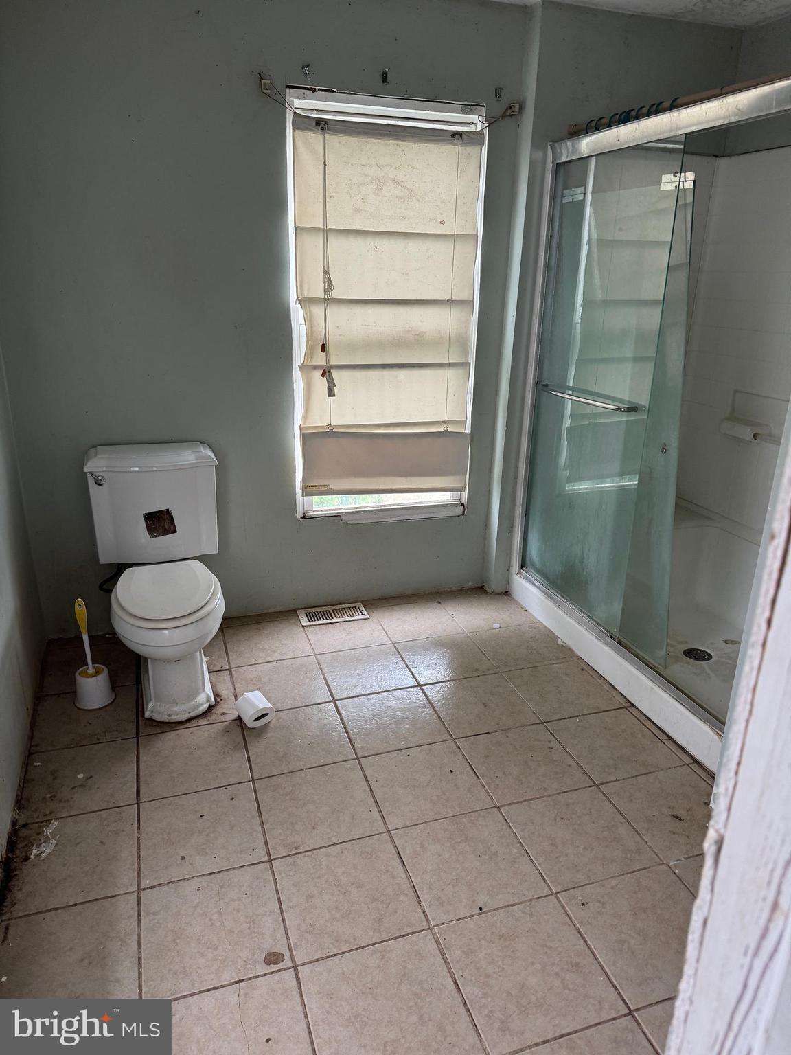 7382 Bullbegger Road Oak Hall, VA 23416 - Photo 17 of 18 a bathroom with a toilet a sink and a shower