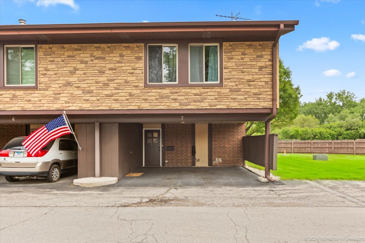 a view of garage with deck
