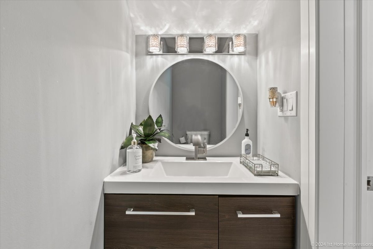 7 Cour Versaille Palos Hills, IL 60465 - Photo 12 of 20 a bathroom with a sink and a mirror