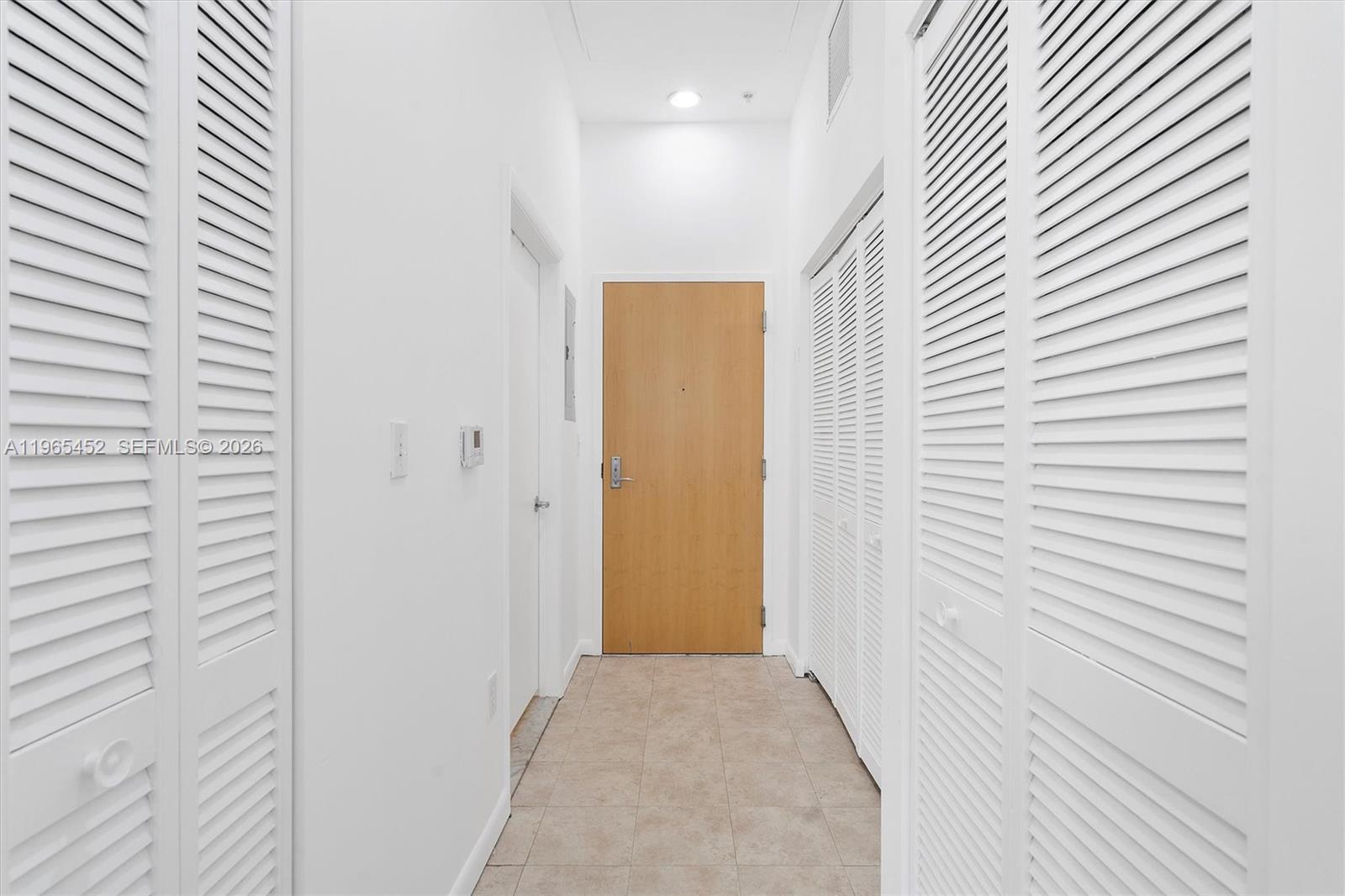 253 Northeast 2nd Street, Unit 223 Miami, FL 33132 - Photo 9 of 16 a view of hallway with livingroom
