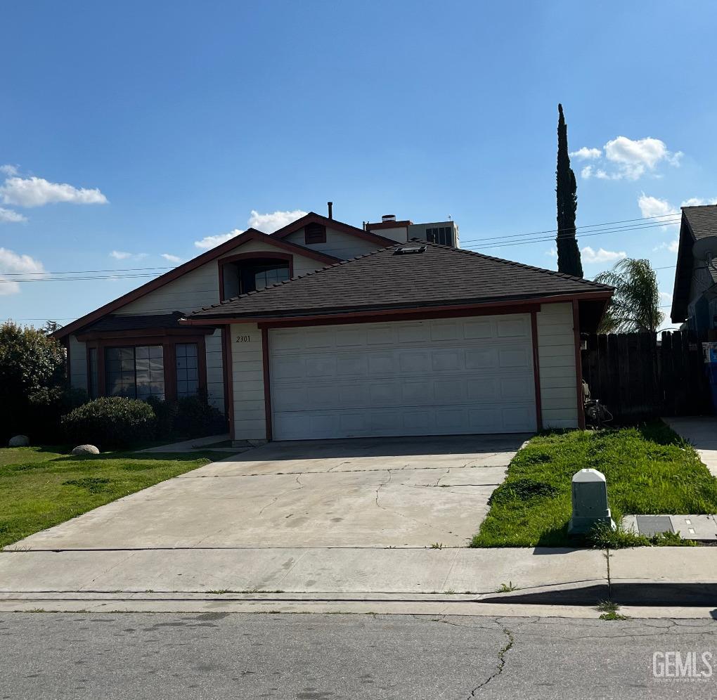 Undisclosed Address Bakersfield, CA 93304 - Photo 1 of 21 a front view of a house with a garden