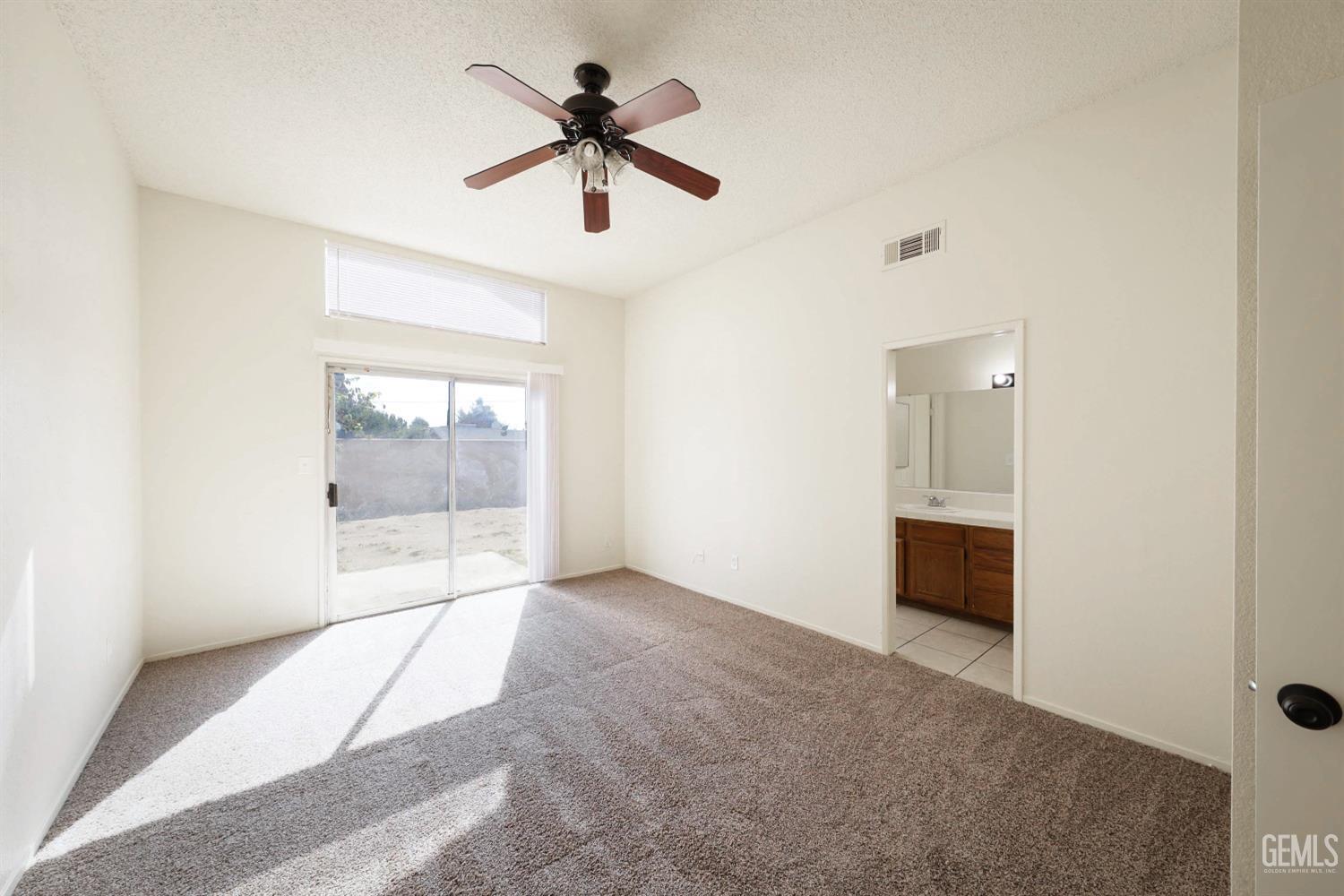 Undisclosed Address Bakersfield, CA 93304 - Photo 15 of 21 wooden floor in an empty room with a window