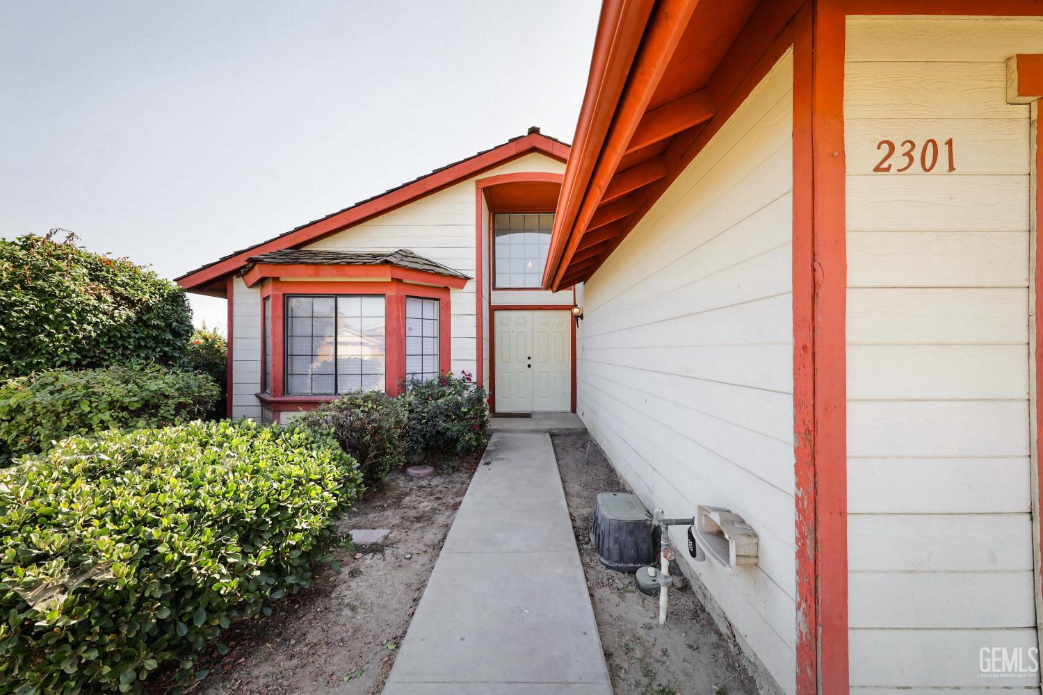 Undisclosed Address Bakersfield, CA 93304 - Photo 2 of 21 a view of a house with a yard
